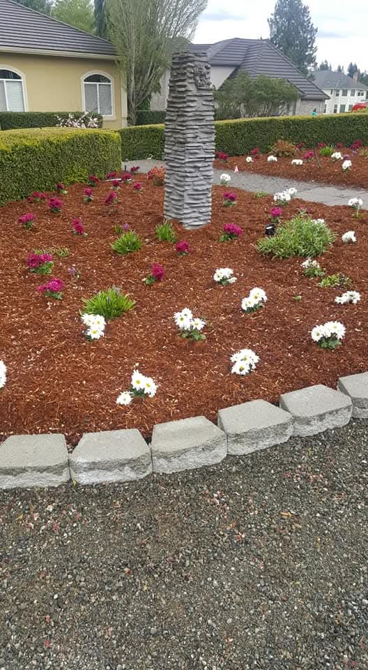 Freshly planted flower bed by Morales Landscaping
